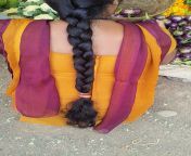chennai girl with oiled long hair braid at a vegetable market.jpg from tamil nadu long hair head shave