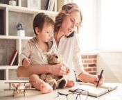 blonde woman with baby working at desk how to be a working mom.jpg from mom handling