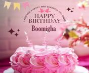 happy birthday boomigha written on image light pink chocolate cake and candle star webp from boomigha