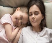 young mom sleeping relaxing bed cute little daughter top view close up calm lying smiling preschooler peaceful 164680935.jpg from sleeping little daughter