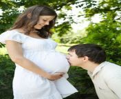 kissing pregnant wife s belly husband his outdoors selective focus 31004796.jpg from husband wife belly kis