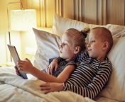 little brother sister lying bed watching videos together cute boy his video digital tablet bedtime 165034826.jpg from video brother and sister in pakistan