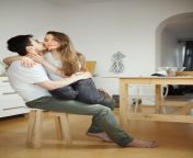 man kisses woman sitting his legs kitchen man kisses women sitting his legs kitchen smiling couple lovers 113582076.jpg from sit on his leg