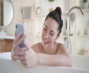 millennial girl bath mobile phone having webcam video conversation enjoy bodycare bathroom attractive young mixed 222560358 jpgw400 from new webcam lady bath