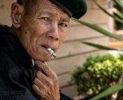 old thai man mae tan noi thailand march elderly sits smokes remote train station mae tan noi one hottest recorded 54630841.jpg from thai old man