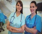 portrait two female nurse standing arms crossed hospital 84073527.jpg from two nurse