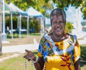 portrait melanesian australian mature woman smiling outdoors showing hand made jewerly has 172486308.jpg from australian mature
