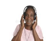 senior african woman listening music head phones studio shot 36640283.jpg from ebony listening