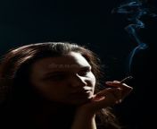 beautiful woman smoking cigarette black background sad woman smoking 102406505.jpg from indian woman smoking sex videosাহির চà
