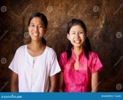 two happy young myanmar girls portrait beautiful traditional smiling close up head shot 64699923.jpg from myanmar cute young