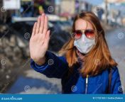 woman medical mask walks alone street quarantine woman medical mask walks alone street 177321505.jpg from wear mask quarantine