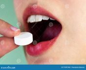 girl puts large white tablet her open mouth put pill mouth take lot medication 191891946.jpg from လိုကါးan village girl cum in mouth sex 3gpavita bh