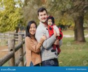 happy smiling asian chinese mother caucasian father dad baby girl ladybug costume family autumn fall park outdoors 181840732.jpg from chinese father and daughter sex videos