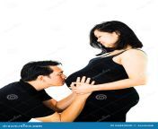 husband kiss his pregnant wife belly white background 66083890.jpg from husband wife belly kis