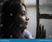 indian bengali brunette girl striped semi formal wear standing balcony portrait looking window thoughtful 171048093.jpg from ।বাংলা নেকট
