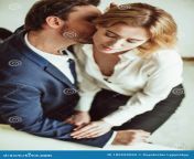 love affair work business men kisses neck women sitting his lap two people flirting together office high angle view 189252093.jpg from job kiss