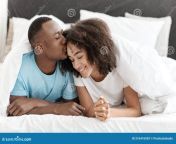 lovely gentle cute smiling beautiful couple under blanket bed enjoying spare time weekend cheerful young african american 216416929.jpg from cute nice couple in bed