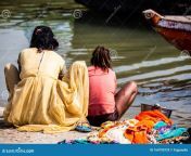 mother daughter low caste washing their clothes ganges river varanasi india 164790729.jpg from indian mom cloth washing