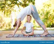 mom son do yoga summer park healthy lifestyle family sport 170664513.jpg from mom son yoga