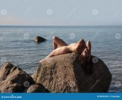 naked girl outdoors enjoying nature beautiful young nude woman lies large stones against sea lady nude perfect body 88526633.jpg from naked enjoying full body