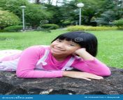 portrait happy asian girl bang short black hair smilling lying rock park 234648734.jpg from asían short hair