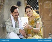 rural indian wife husband using digital tablet village couple 205358239.jpg from village husband and wife