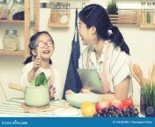 asian woman mom daughter play together kitchen hold tablet teach little girl how to cook process vintage style 154250048.jpg from japanese mom teach about