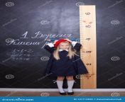 back to school schoolgirl blackboard ruler schoolgirl answers lesson first grader near chalk board ki 147713898.jpg from school ki g