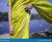 beautiful indian young model wearing green traditional saree standing front river landscape indian girl wearing green 183818910.jpg from saree open pissingphotos