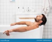 bearded man taking bath closed eyes home 201499690.jpg from man taking a bath