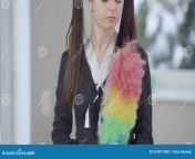 camera moves up as slim caucasian young woman maid uniform standing indoors colorful dust brush positive confident lady 216877480.jpg from model rebecca brima d