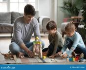 caring young daddy sitting floor playing toys lovely cute small daughter son happy little children siblings having fun 193634483.jpg from daddys toy