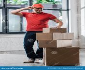 cheerful delivery man touching cap looking carton cheerful delivery man touching cap looking carton boxes 190487746.jpg from delivery man is touching the bum and breast of hot woman