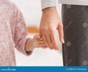 close up daughter holding father finger little supporting care parenthood concept 178086736.jpg from real father finger daughter