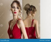 cute woman changing room very beautiful female hair style make up trying red dress near mirror fashion portrait 69157642.jpg from view full screen cute changing and showing