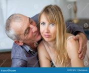 elderly man embracing kissing his young wife sexy lingerie lying bed their home couple age difference 109216767.jpg from young wife and his old