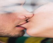 closeup shot of young couple kissing each other at home throughout a windows glass adsf02922.jpg from couple kis