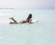 young woman lying on surfboard floating on the sea wpef01066.jpg from lying in sea