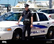 policeman standing by his police car e7wdem.jpg from police man a