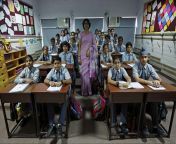 in new delhi india archana shori teaches 7th grade students inside their classroom at rukmini devi public school.jpg from indian classroom
