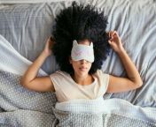 young woman of color wearing a sleep mask resting on her back jpgitok65h2xzft from sleep xxvideos com