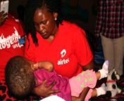 airtel uganda csr manager charity rwabutomize bukenya shares a moment with aloysius maria ngombya who suffers from hydrocephalus 599x399.jpg from bukenya enyoys moment with young lady jpg