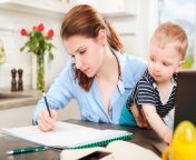 young mother studying at home with baby.jpg from education mother