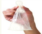 how to put female condom step 2 hold and squeeze.jpg from female condom in