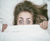 female with blue eyes covered with white blanket royalty free image 1031144532 1559581956.jpg from mature closeup farting