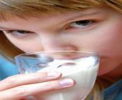 young woman drinking milk aj photoscience photo library.jpg from women milk