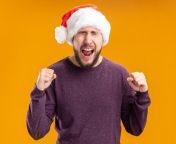 young man purple sweater santa hat shouting crazy happy excited clenching fists standing orange background 141793 39707 jpgsize626extjpg from crazy holiday 039