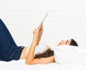 young arab woman lying bed using tablet 1187 33215 jpgsize626extjpg from arabic woman lying on bed