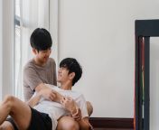 asian gay couple lying hugging floor home young asian lgbtq men kissing happy relax rest together spend romantic time living room with rainbow flag modern house morning 7861 1983 jpgsize626extjpggaga1 1 87170709 1707523200semtais from asian gay pg