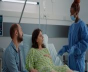 caucasian family expecting baby hospital ward maternity young pregnant woman sitting bed talking african american nurse about childbirth assistance patient waiting delivery 482257 30855.jpg from pregnant aurat ki delivery videos bf xxxxshakila aunty nude 3gp vid